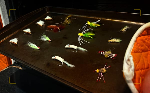 Flies displayed include: chubby chernobyl, clouser minnow, barr's meat whistle, popper, crazy charlie, and turneffe crab 